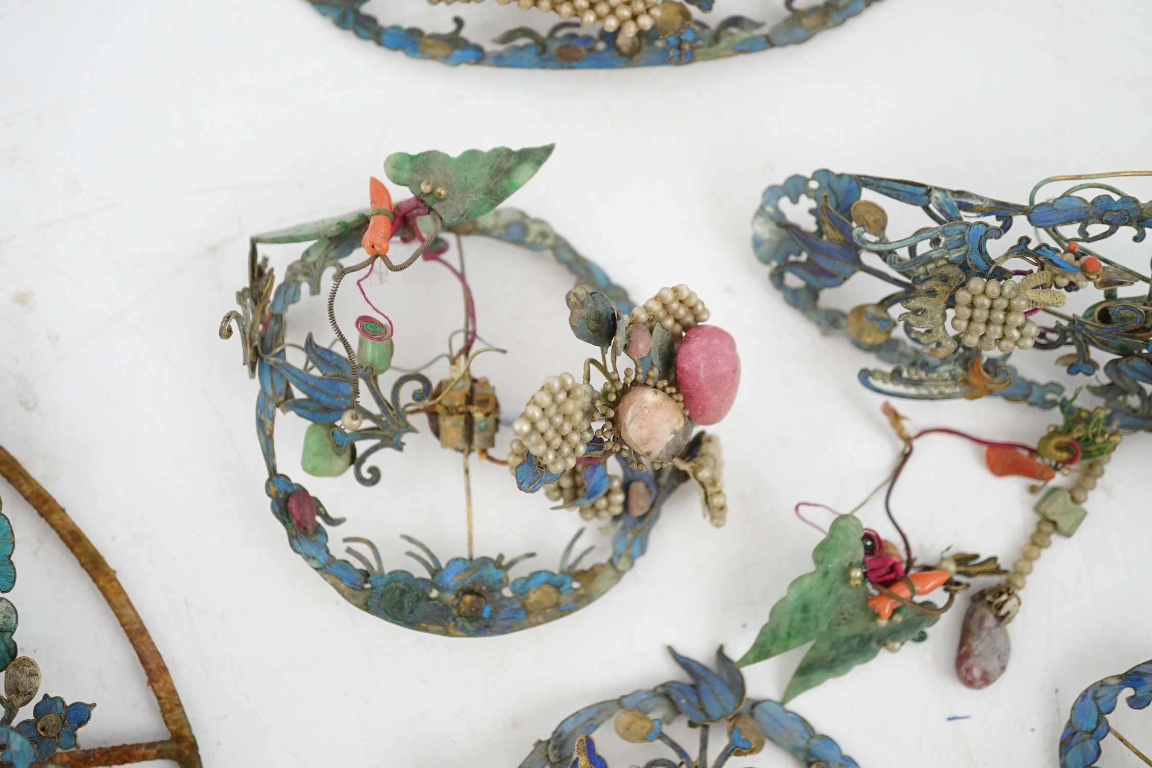 A group of eight Chinese kingfisher feather, jade, seed pearl, coral and hardstone mounted headdresses and ornaments, late Qing dynasty, some losses